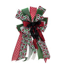 A Christmas-themed ribbon bow featuring multiple patterns including red and white polka dots, green and white gingham, red and green berry prints, solid green, and a black tinsel center, isolated on a white background.
